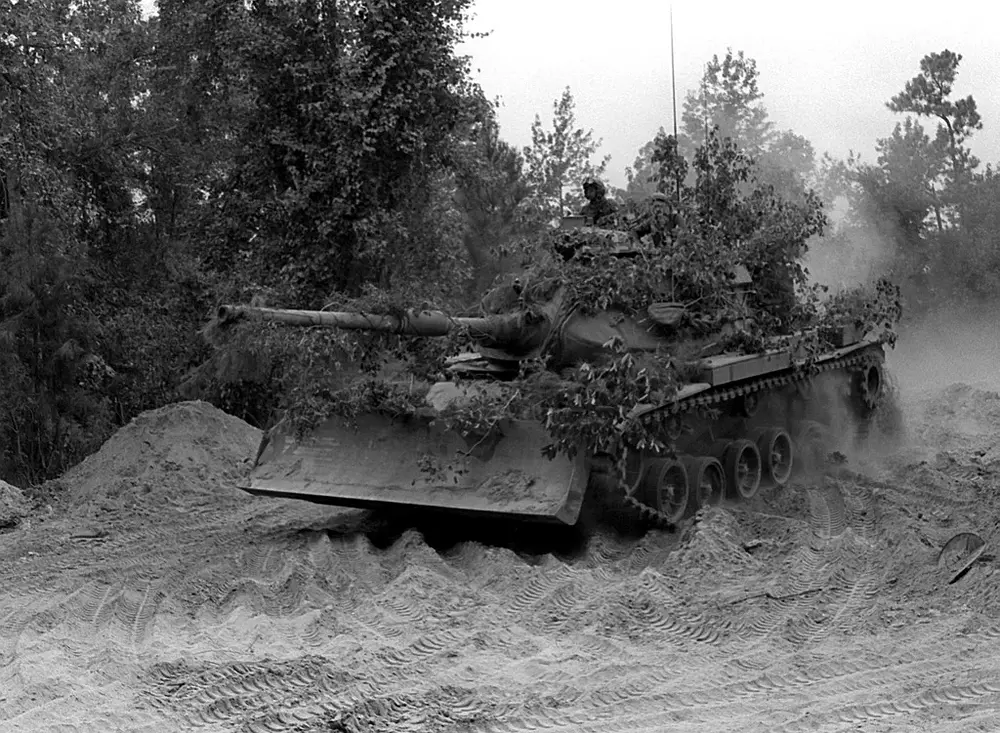 a-camouflaged-m-60a1-tank-from-the-8th-marines-equipped-with-a-bulldozer-blade-b78fdc-1024