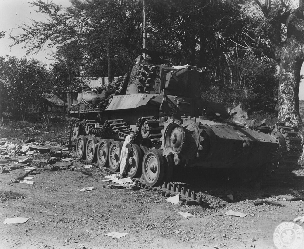 SC_337247_-_Jap_medium_tanks_which_head_the_convoy_of_30_trucks,8_tanks_and_8_field_pieces_is_shown_knocked_out_by_two_bazooka_shells.(52209253640)