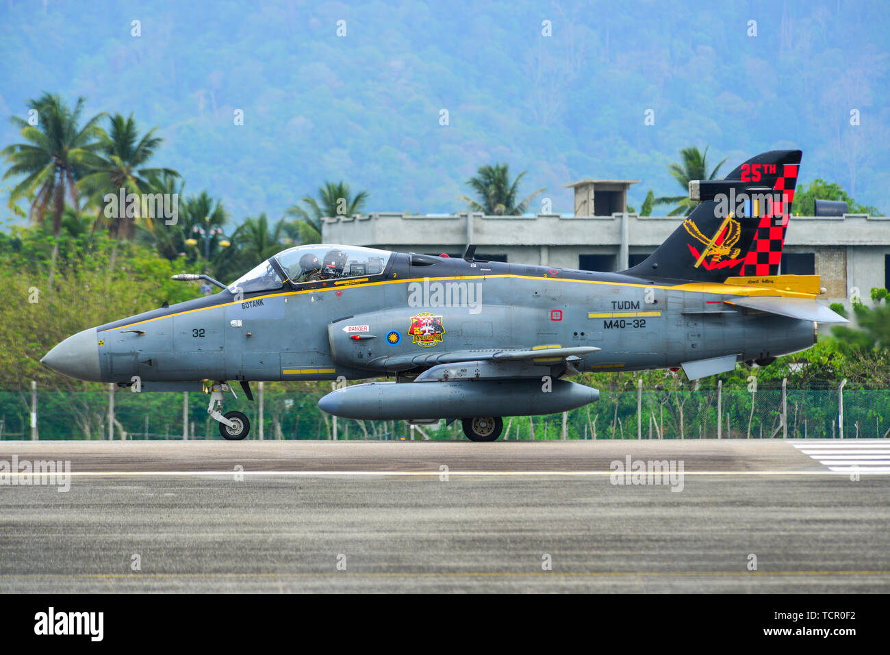 langkawi-malaysia-mar-31-2019-british-aerospace-hawk-200-of-royal-malaysian-air-force-tudm-m40-32-taxiing-on-runway-of-langkawi-airport-lgk-TCR0F2