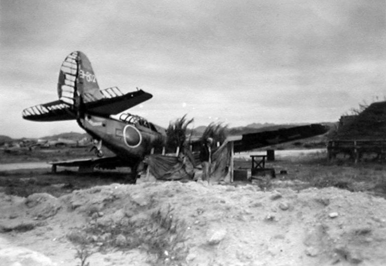 a-shot-down-u-s-navy-curtiss-sb2c-helldiver-set-up-as-a-japanese-decoy-plane-at-yokosuka-naval-air-base-1945-768x529