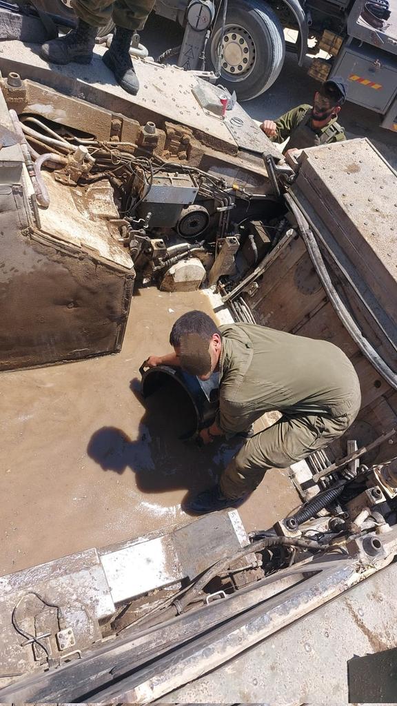 cleaning-the-engine-compartment-of-a-namer-apc-and-a-v0-3ab69uw4o31e1