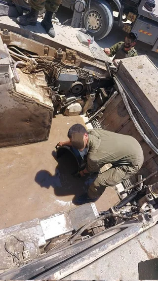cleaning-the-engine-compartment-of-a-namer-apc-and-a-v0-3ab69uw4o31e1