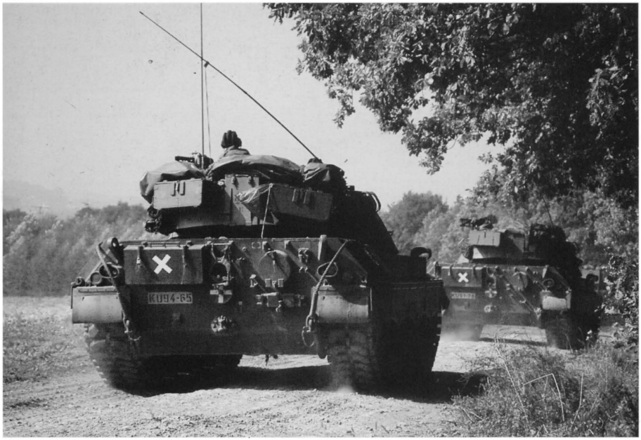 A company of Dutch Leopard 1-V on the march during exercise 'Free Lion' in September 1988_ Yellow crosses nominate them playing enemy vehicles