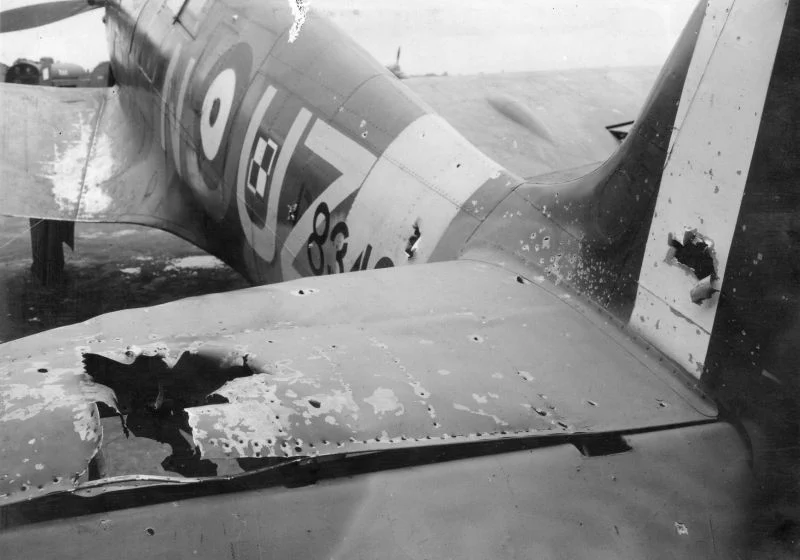Spitfire MkIIb_stabilizer_hit_by_20mm_shell